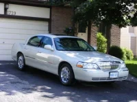 Lincoln Town Car in summer.webp