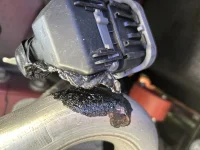 Melted WIre Against Muffler Passenger side.webp